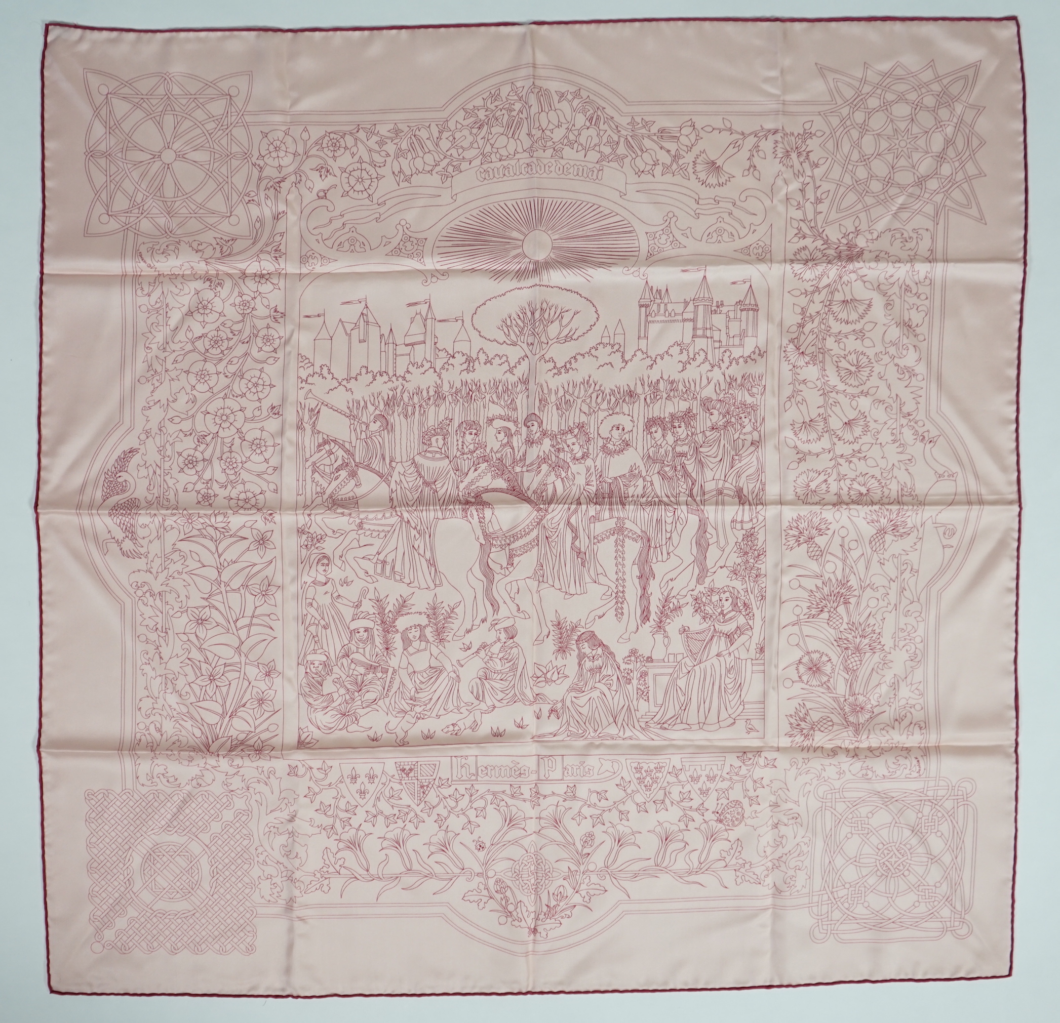 A Hermès Cavalcade de Mai printed light pink silk scarf, 90cm x 90cm